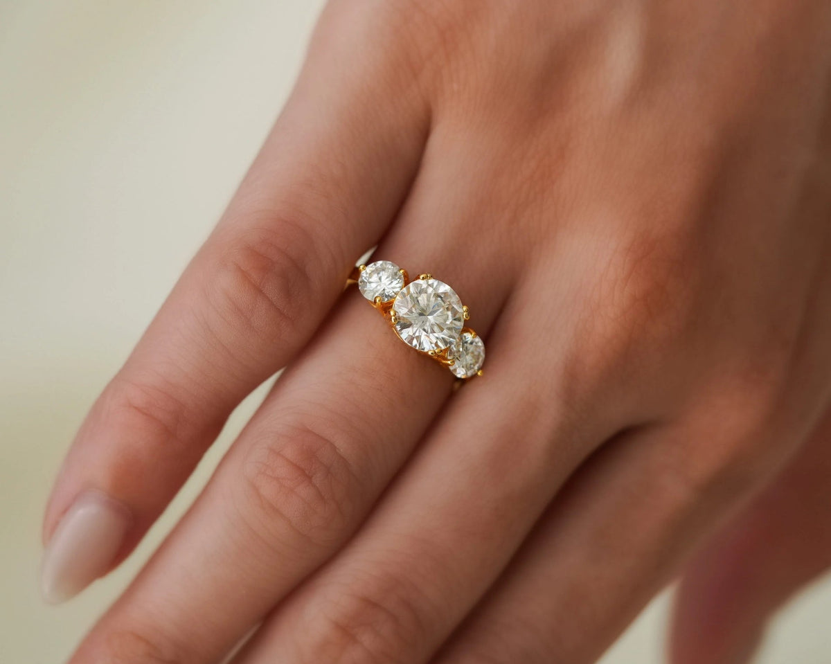 Three-stone round diamond ring in yellow gold