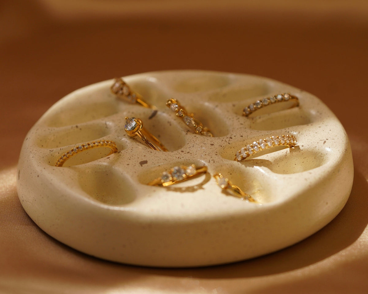 Gold diamond rings displayed on a jewelry tray